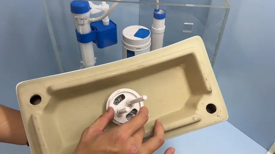 Toilet tank parts, flange, or installation hardware during a plumbing service visit in Pasadena Glen
