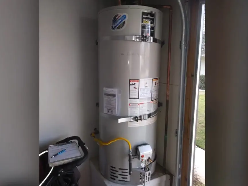 Residential water heater tank, supply lines, and service fittings during a plumbing service visit in Eagle Rock on the er-side-01 section