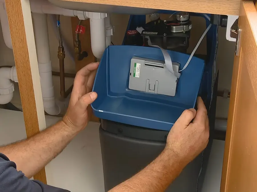 Water softener tank, control valve, and service connections during a plumbing service visit in West Altadena on the wa-side-01 section